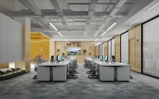 A modern workplace with desks and computers, showing industrial style office decor.