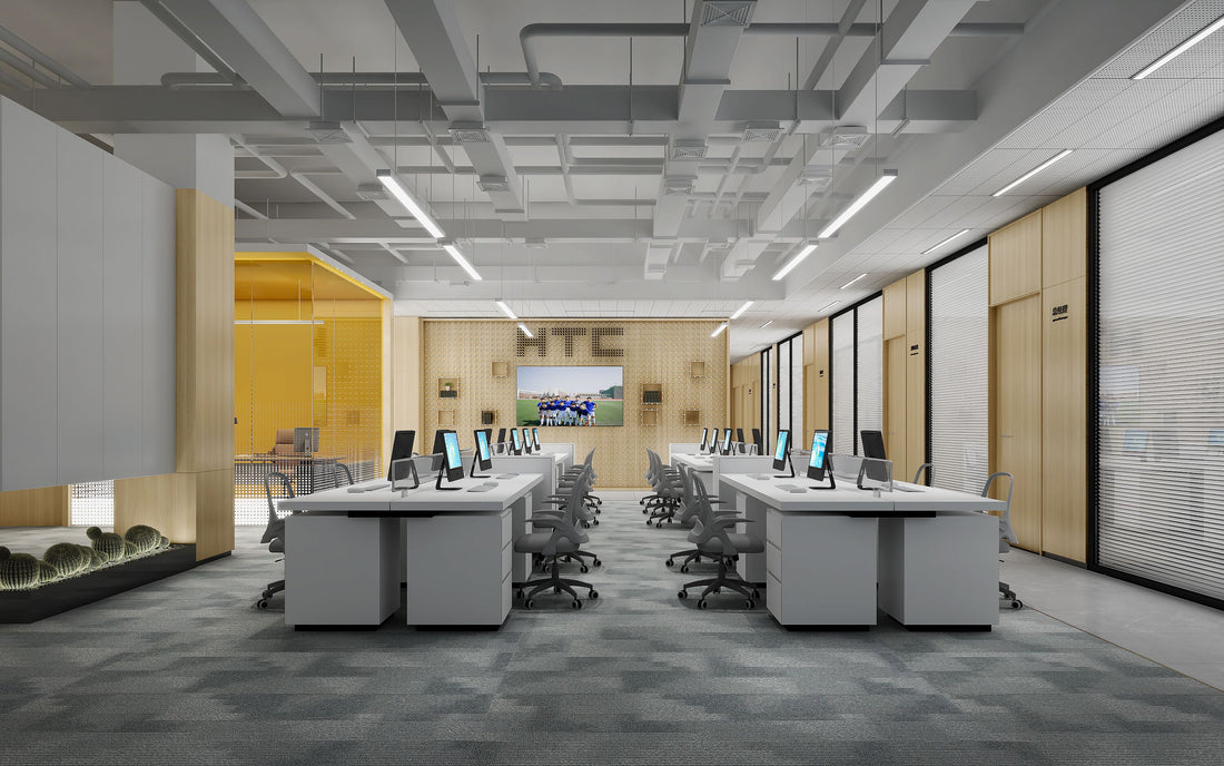 A modern workplace  with desks and computers, showing industrial style office decor.