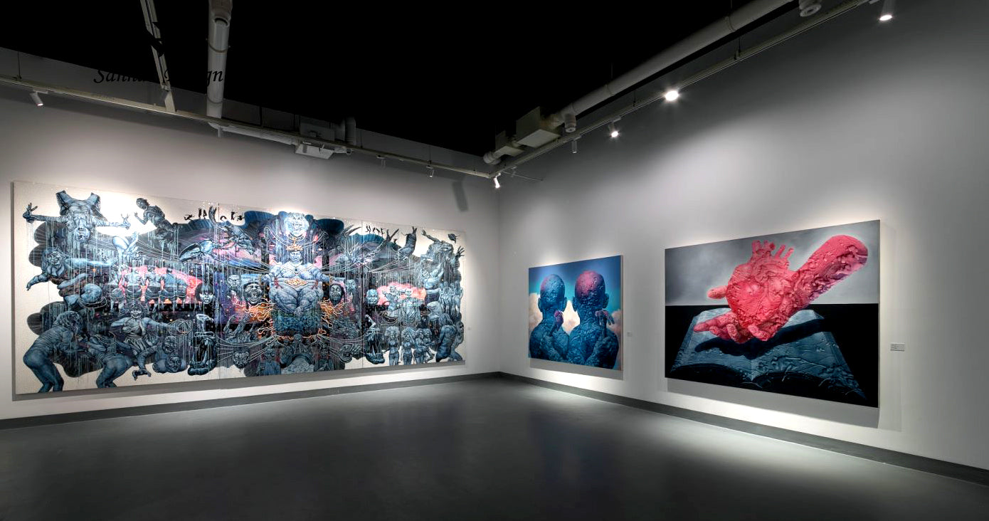 Three abstract science fiction paintings are displayed in a corner of the art museum
